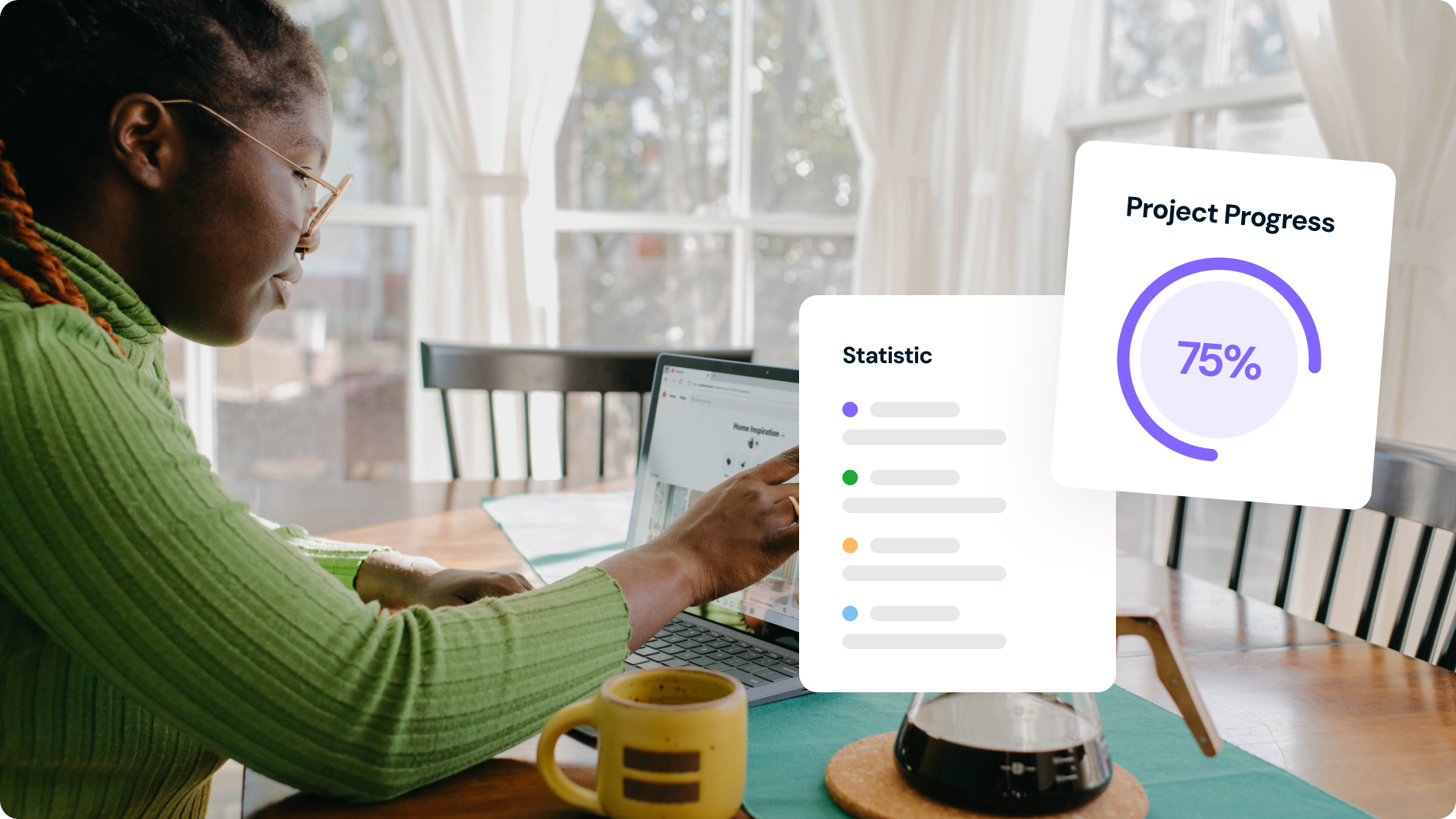 Person working on a laptop with project progress and statistic graphics displayed.